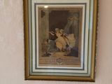 a picture hanging on the wall of a bathroom