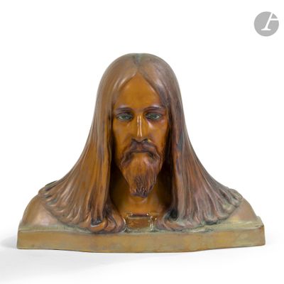 statue of a man with long hair and a beard on a wooden base
