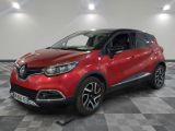 a red car is parked in a room with a checkered floor