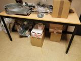 a table with a lot of items on it in a room