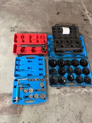 two blue and one red plastic case with wheels and wrens