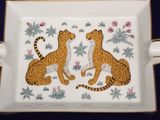an image of two cats sitting on top of a white tray