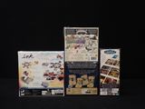 three boxed nintendo wii games sitting on top of a black table