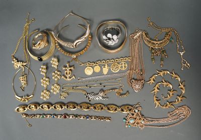 many different types of jewelry on the table