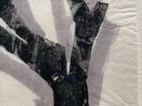 a black and white drawing of a tree on a piece of paper