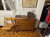 hardwood flooring in a bedroom with a desk and a chair