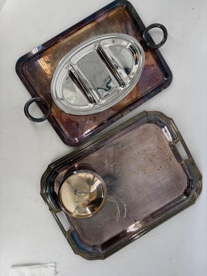 two trays that are sitting on a table