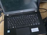 several laptops are sitting on a table with a keyboard and mouse