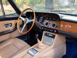 a dashboard and steering wheel of a classic car