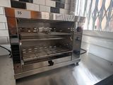a toaster oven sitting on a counter in a kitchen