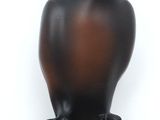 statue of an owl on a black base on a white background