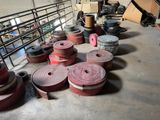 many rolls of red tape on the floor in a warehouse