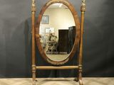 an image of a mirror sitting on top of a wooden stand