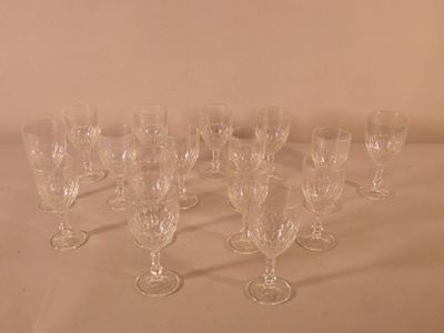 several empty wine glasses are lined up on a table