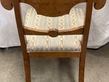 wooden chair with upholstered seat and arm rest