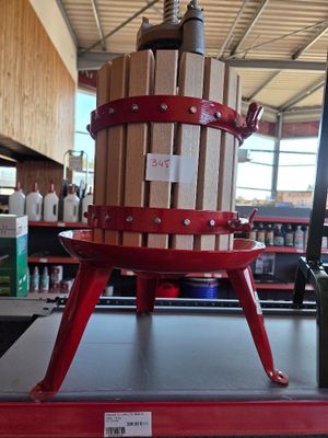 a picture of a wine press on display in a store