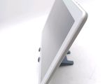 a tablet computer sitting on a stand on a table