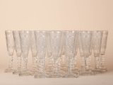a lot of glasses that are sitting on a table