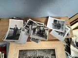 many old black and white photos hanging on the wall