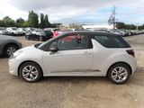 a picture of a small white car parked in a parking lot