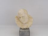 an image of a sculpture of a man ' s head on a marble block
