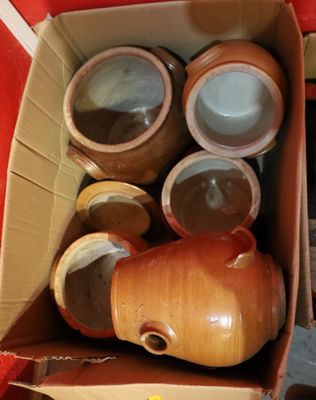 a box full of jars and containers sitting on a table