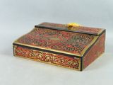 an image of a red and gold box on a white background