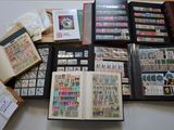 many different types of stamps in a book on a table