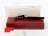 a pen sitting on top of a red box next to a card