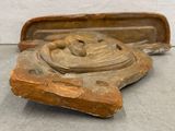 a wooden object that is sitting on the floor