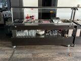 an image of a bar in a restaurant with a lot of wine glasses on the counter