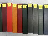 a lot of books that are lined up on the floor