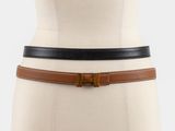 ceinture en cuir marron et noir sur le torse d'un mannequin