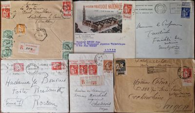 several old envelopes are stacked on top of each other on a table