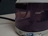 a white and purple blender sitting on a counter