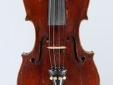 a close up of a violin with a bow on a white background
