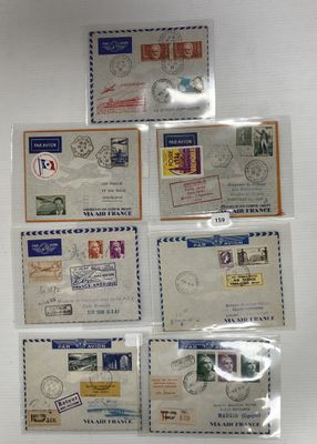 many different stamps on the envelopes on the table