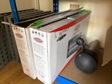a box that is sitting on a shelf next to a ball