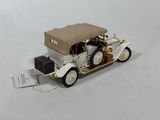 a toy car that is sitting on a white surface