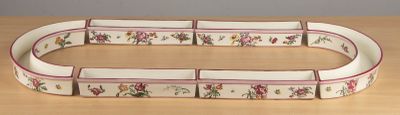 a picture of a belt with flowers on it on a table