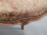 an image of a close up of a chair with a floral upholstered seat