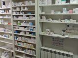 many shelves of medicine and other medical supplies in this pharmacy room