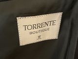 the label of a black jacket with a white and black design