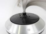 a hair dryer that is spinning on top of a table