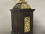 a gold statue of an angel on top of a wooden box
