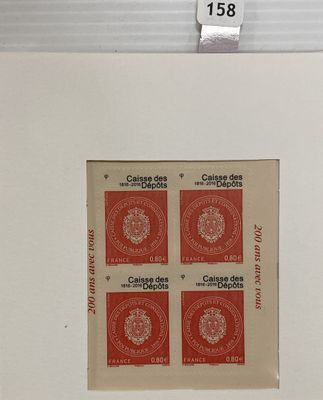 three red stamps on a piece of paper on a white surface