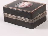 a small black box with a picture of a man on it