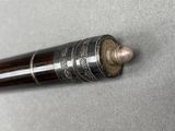 a close up of a pen on a table