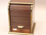a small wooden box that has a key in it