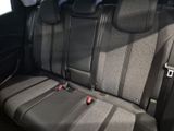 the back seats of a car with black seats and gray seats
